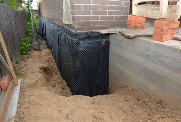 Happy homeowners after waterproofing job in Cromwell